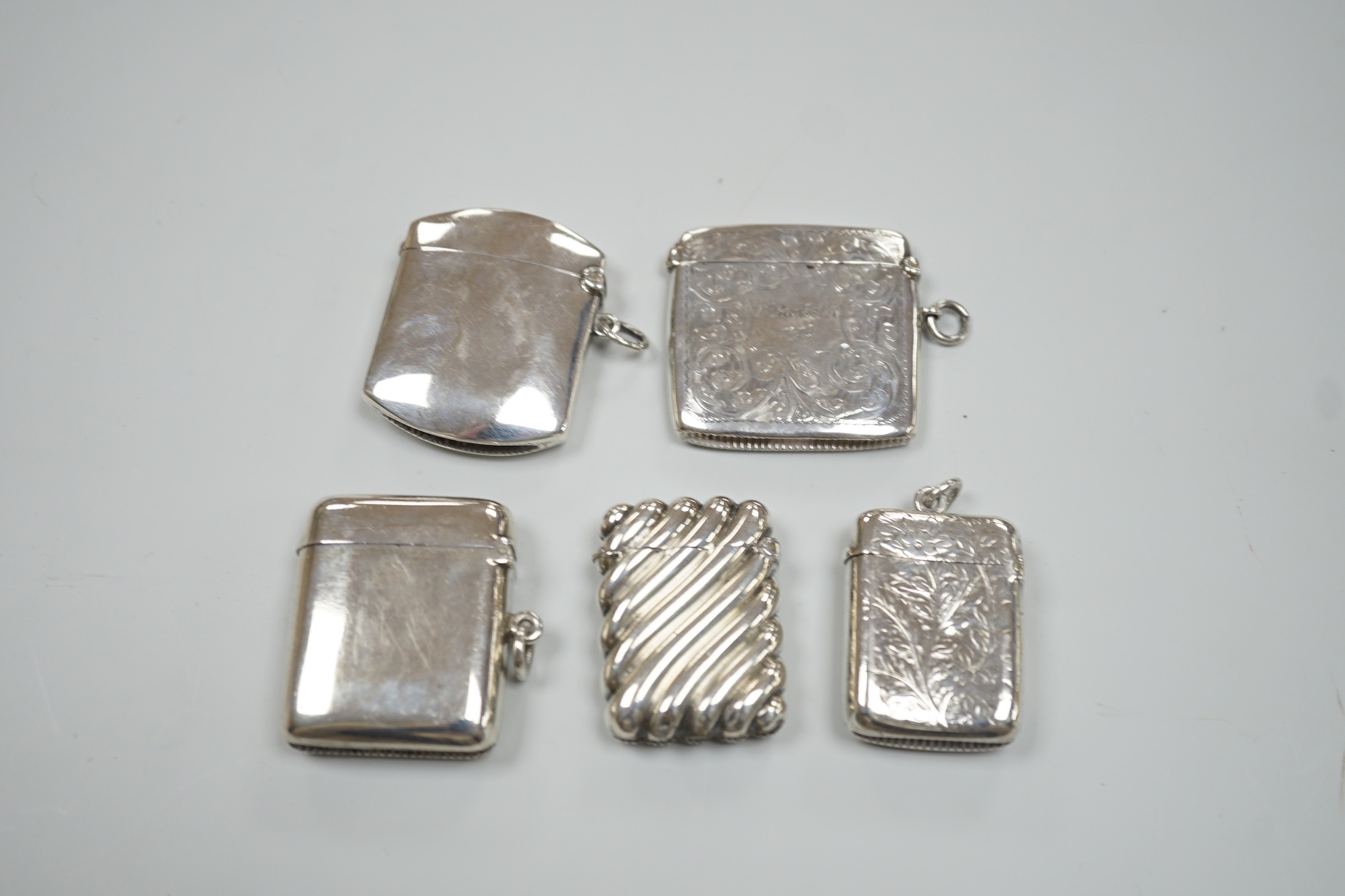 Five assorted late Victorian/Edwardian silver vesta cases, largest 46mm.